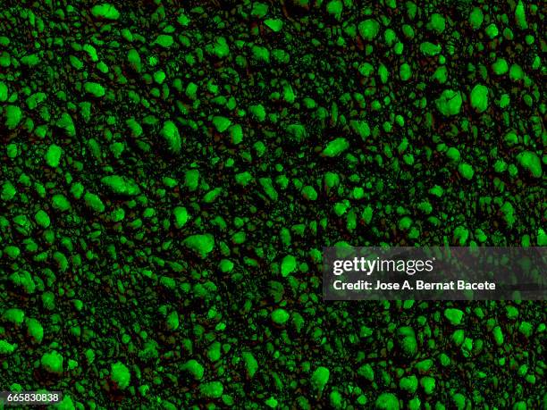 full frame of coarse and wavy textures of colored foam, green background - arrugado stock pictures, royalty-free photos & images