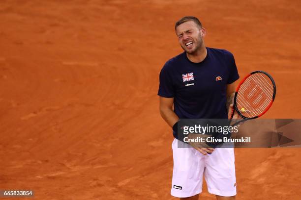 Daniel Evans of Great Britain reacts during the singles match against Jeremy Chardy of France on day one of the Davis Cup World Group Quarter-Final...