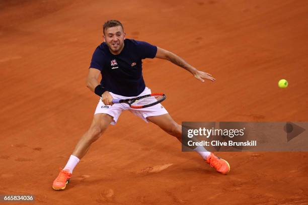 Daniel Evans of Great Britain hits a forehand during the singles match against Jeremy Chardy of France on day one of the Davis Cup World Group...