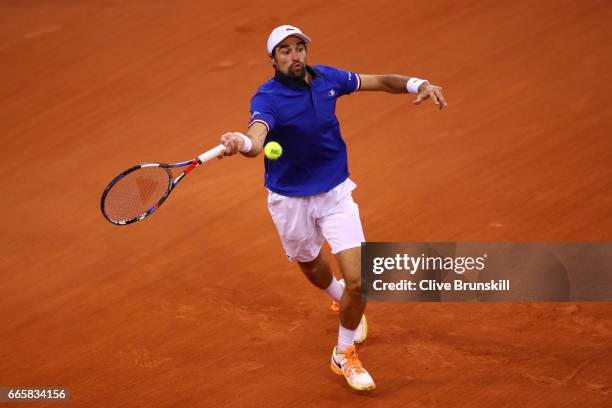 Jeremy Chardy of France plays a forehand during the singles match against Daniel Evans of Great Britain on day one of the Davis Cup World Group...