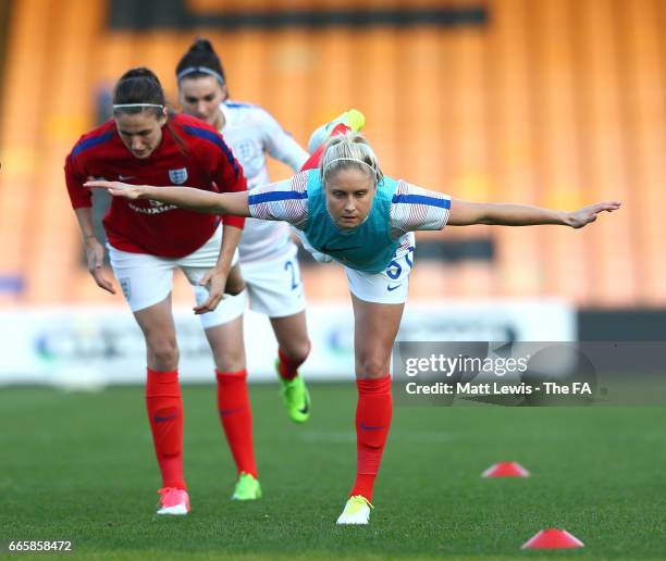 Steph Houghton of England and teammates warm up prior to kickoff during the Women's International friendly match between England and Italy at Vale...