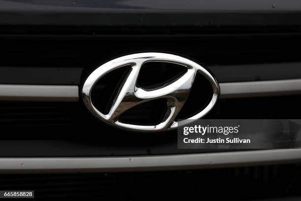The Hyundai logo is displayed on a brand new Hyundai Santa Fe SUV at a Hyundai dealership on April 7, 2017 in Colma, California. South Korean...