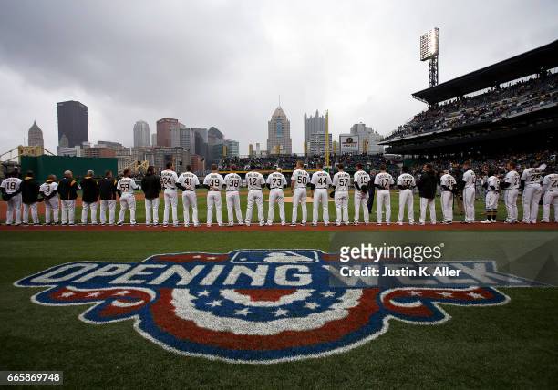 The Pittsburgh Pirates stand during the National Anthem before the game against the Atlanta Braves on Opening Day at PNC Park on April 7, 2017 in...