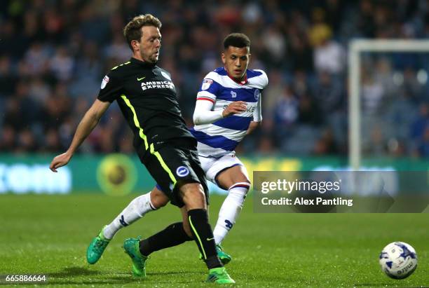 Dale Stephens of Brighton and Hove Albion and Ravel Morrison of QPR in action during the Sky Bet Championship match between Queens Park Rangers and...