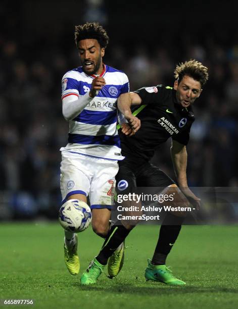 Queens Park Rangers' James Perch battles for possession with Brighton & Hove Albion's Dale Stephens during the Sky Bet Championship match between...