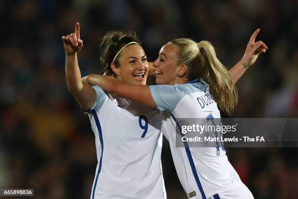 Jodie Taylor of England is congratulated by teammate Toni Duggan of England after scoring the opening goal during the Women's International friendly...