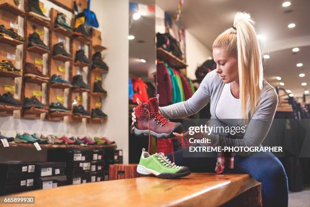 customer in sports store - sports merchandise stock pictures, royalty-free photos & images