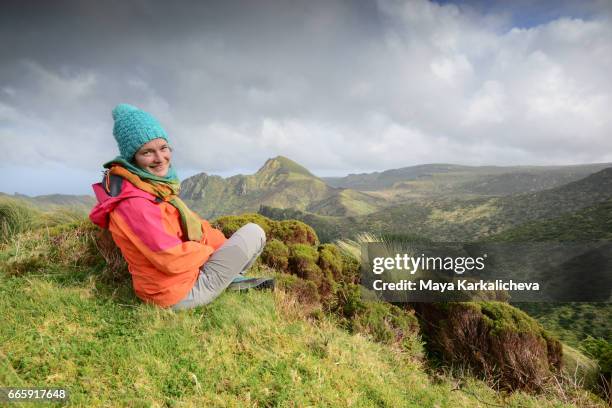 happy female tourist in the azores mountains - azores stock pictures, royalty-free photos & images