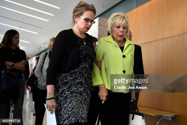 Tammy Heman walks with her mother Marti Kohnke to speak to the press after the sentencing hearing for Richard Kirk, that shot and killed her sister...