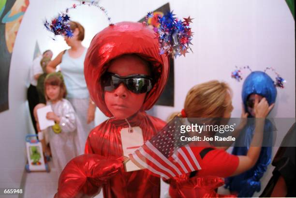 Brandon Reiser,six, dressed as a little alien, competes in the alien costume contest in Roswell, New Mexico July 1, 2000. He was participating in the...
