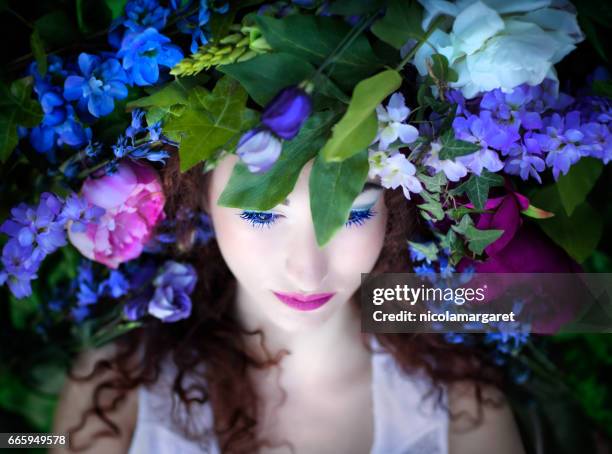 young woman with spring flowers - nicolamargaret stock pictures, royalty-free photos & images