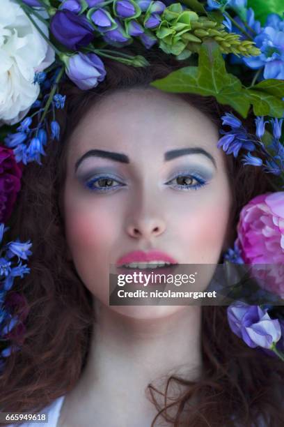 young woman with spring flowers - nicolamargaret stock pictures, royalty-free photos & images