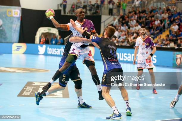 Olivier Nyokas of HBC Nantes is trying to shoot the ball against Bastien Lamon of Dunkerque Handball during the semi-final match of the Final Four...