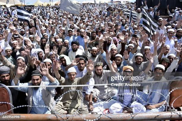 People wait to pray behind Imam-e-Kaaba Sheikh Saleh Bin Muhammad Ibrahim during the centennial celebrations of Jamiat Ulema-i-Islam in Nowshera on...