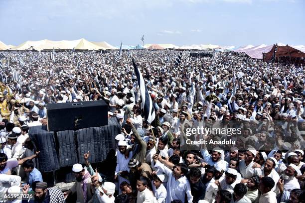 People wait to pray behind Imam-e-Kaaba Sheikh Saleh Bin Muhammad Ibrahim during the centennial celebrations of Jamiat Ulema-i-Islam in Nowshera on...