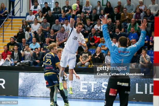 Uwe Gensheimer of Paris Saint Germain is shooting the ball against Slavisa Djukanovic of Saint-Raphael Var Handball during the semi-final match of...