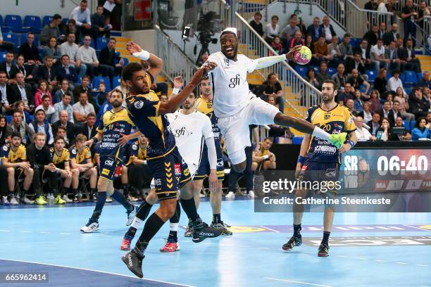 Luc Abalo of Paris Saint Germain is shooting the ball against Adrien Dipanda of Saint-Raphael Var Handball during the semi-final match of the Final...