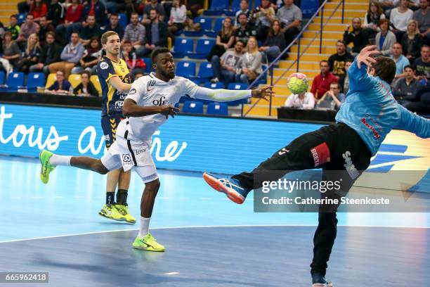 Luc Abalo of Paris Saint Germain is shooting the ball against Slavisa Djukanovic of Saint-Raphael Var Handball during the semi-final match of the...