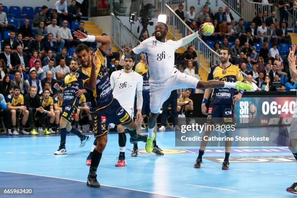 Luc Abalo of Paris Saint Germain is shooting the ball against Adrien Dipanda of Saint-Raphael Var Handball during the semi-final match of the Final...