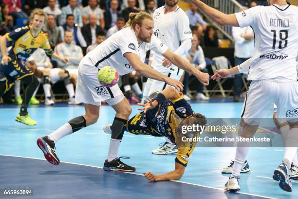 Daniel Sarmiento of Saint-Raphael Var Handball is trying to shoot the ball against Henrik Mollgaard of Paris Saint Germain during the semi-final...