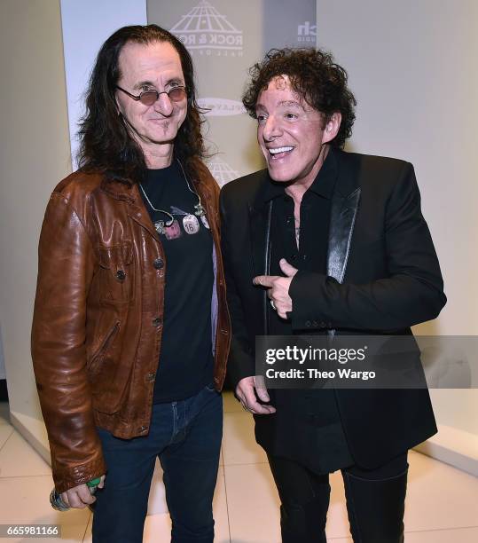 Inductee Geddy Lee of RUSH and 2017 Inductee Neal Schon of Journey attend the 32nd Annual Rock & Roll Hall Of Fame Induction Ceremony at Barclays...