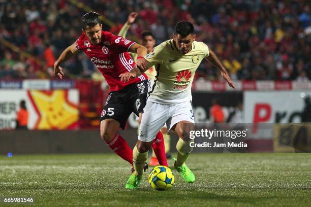 Guido Rodriguez of Tijuana fights for the ball with Silvio Romero of America during the 13th round match between Tijuana and America as part of the...