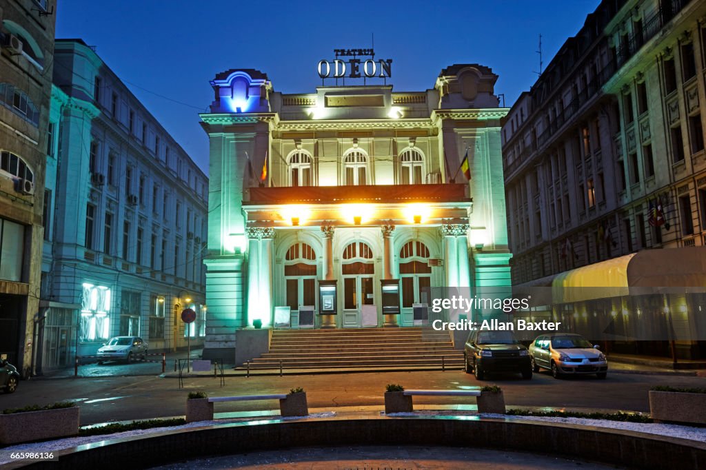 Odean Theatre in Bucharest located on Calea Victoriei illuminated at night.