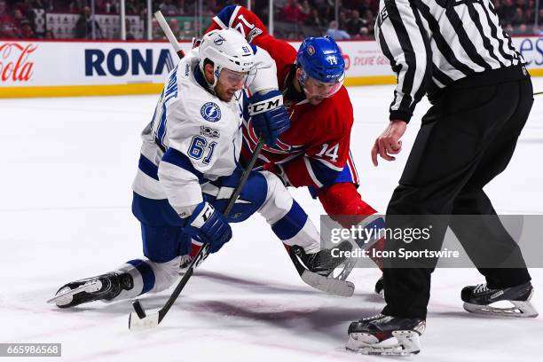 Tampa Bay Lightning Winger Gabriel Dumont wins face off against Montreal Canadiens Center Tomas Plekanec during the Tampa Bay Lightning versus the...