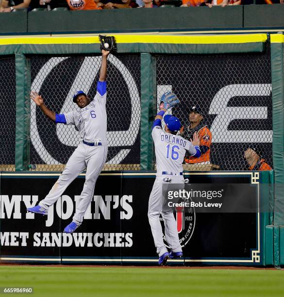 Lorenzo Cain of the Kansas City Royals makes a leaping catch at the wall on fly ball by George Springer of the Houston Astros in the eighth inning as...