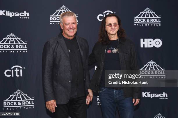 Presenters Alex Lifeson and Geddy Lee of Rush attend the Press Room of the 32nd Annual Rock & Roll Hall Of Fame Induction Ceremony at Barclays Center...