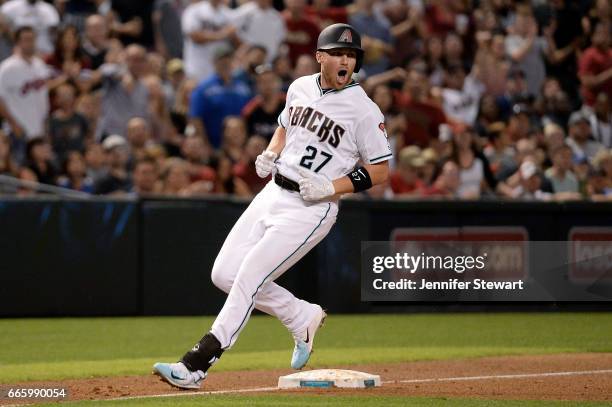 Brandon Drury of the Arizona Diamondbacks reacts after hitting an RBI triple to deep left during the fifth inning against the Cleveland Indians at...