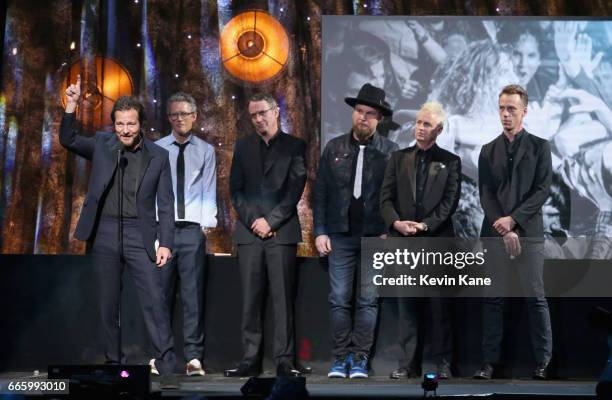 Inductees Eddie Vedder, Dave Krusen, Stone Gossard, Jeff Ament, Mike McCready and Matt Cameron of Pearl Jam speak onstage at the 32nd Annual Rock &...