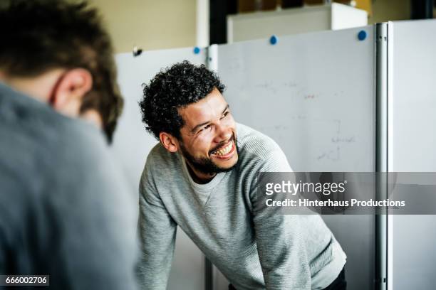 portrait of casual businessman during meeting - werken stockfoto's en -beelden