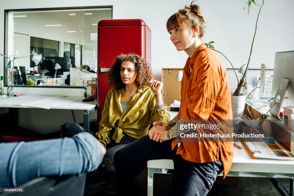 Casual businesswomen brainstorming in office