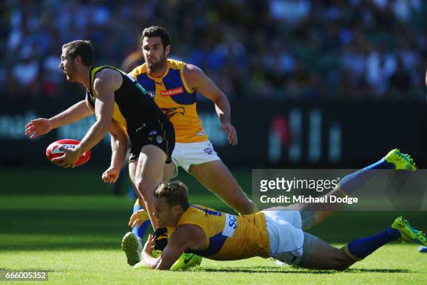Sam Mitchell of the Eagles tackles Kane Lambert of the Tigers during the round three AFL match between the Richmond Tigers and the West Coast Eagles...