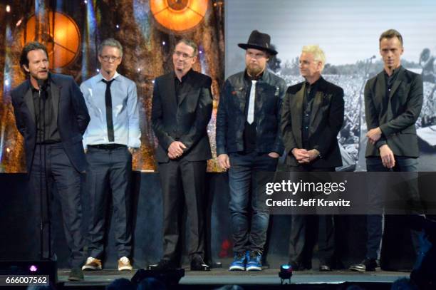 Inductees Eddie Vedder, Dave Krusen, Stone Gossard, Jeff Ament, Mike McCready and Matt Cameron of Pearl Jam speak onstage at the 32nd Annual Rock &...