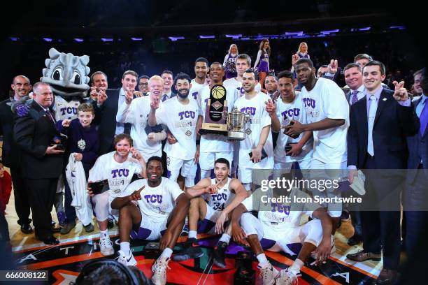 The TCU Horned Frogs hold the NIT Tournament Trophy and celebrate after defeating the Georgia Tech Yellow Jackets and winning the 2017 NIT on March...