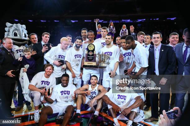 The TCU Horned Frogs hold the NIT Tournament Trophy and celebrate after defeating the Georgia Tech Yellow Jackets and winning the 2017 NIT on March...