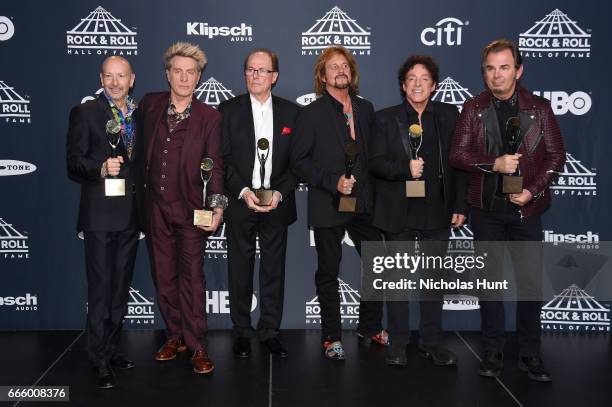 Inductees Steve Smith, Ross Valory, Aynsley Dunbar, Gregg Rolie, Neal Schon, and Jonathan Cain of Journey attend the Press Room of the 32nd Annual...