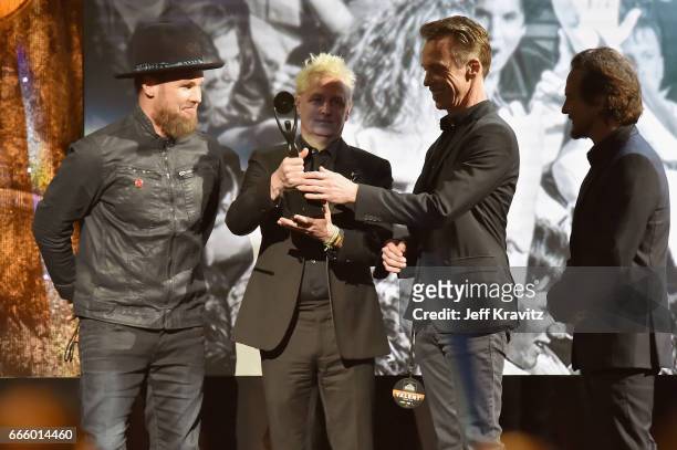 Inductees Eddie Vedder, Jeff Ament, Mike McCready and Matt Cameron of Pearl Jam speak onstage at the 32nd Annual Rock & Roll Hall Of Fame Induction...