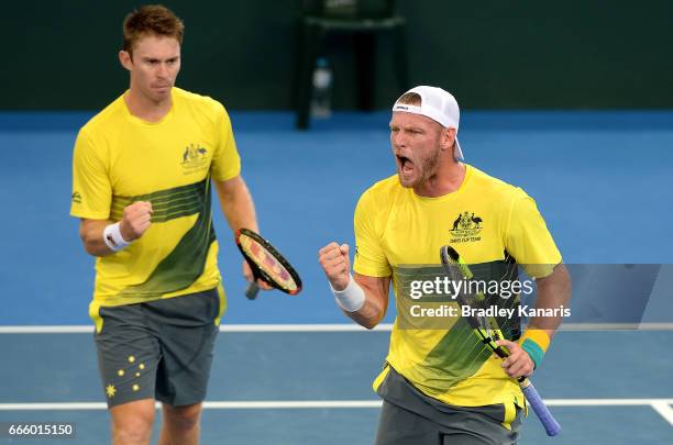 Sam Groth of Australia celebrates winning a point in his doubles match against Steve Johnson and Jack Sock of the USA during the Davis Cup World...