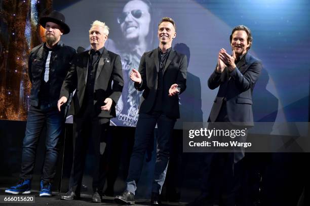 Inductees Jeff Ament, Mike McCready, Matt Cameron and Eddie Vedder of Pearl Jam speak onstage at the 32nd Annual Rock & Roll Hall Of Fame Induction...