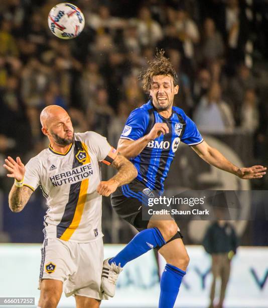 Jelle Van Damme of Los Angeles Galaxy battles Marco Donadel of Montreal Impact during Los Angeles Galaxy's MLS match against Montreal Impact at the...