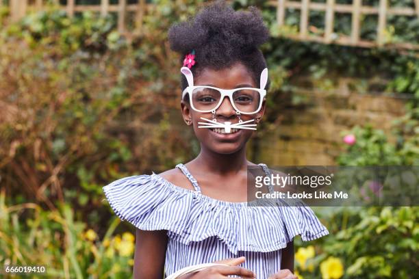 child wearing easter bunny glasses. - eastersowhite stock-fotos und bilder