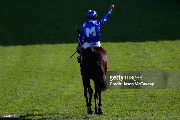 Hugh Bowman riding 'Winx' celebrates winning The Longines Queen Elizabeth Stakes during The Championships Day 2 at Royal Randwick Racecourse on April...