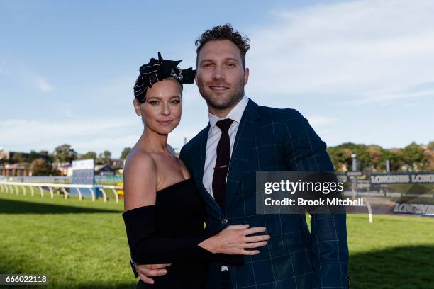 Actor Jai Courtney and Mecki Dent celebrate ont he track after Winx's victory at Royal Randwick Racecourse on April 8, 2017 in Sydney, Australia.