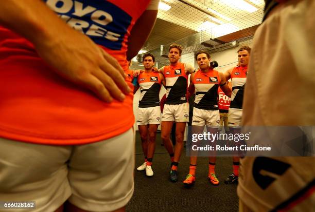 The Giants celebrate after they defeated the Kangaroos during the round three AFL match between the North Melbourne Kangaroos and the Greater Western...