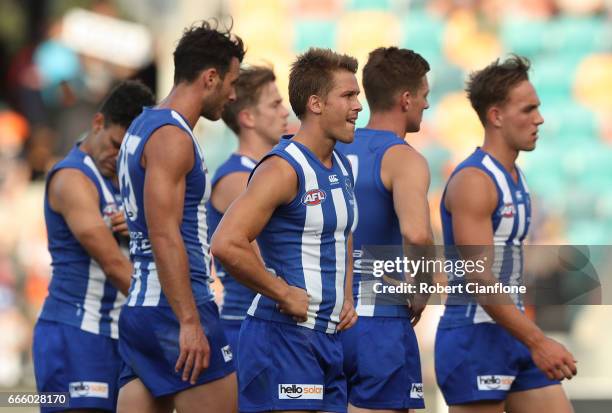 The Kangaroos walk off the ground after they were defeated by the Giants during the round three AFL match between the North Melbourne Kangaroos and...