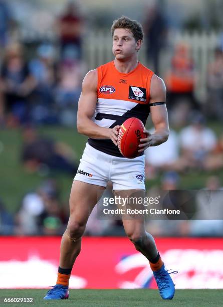 Jacob Hopper of the Giants controls the ball during the round three AFL match between the North Melbourne Kangaroos and the Greater Western Sydney...