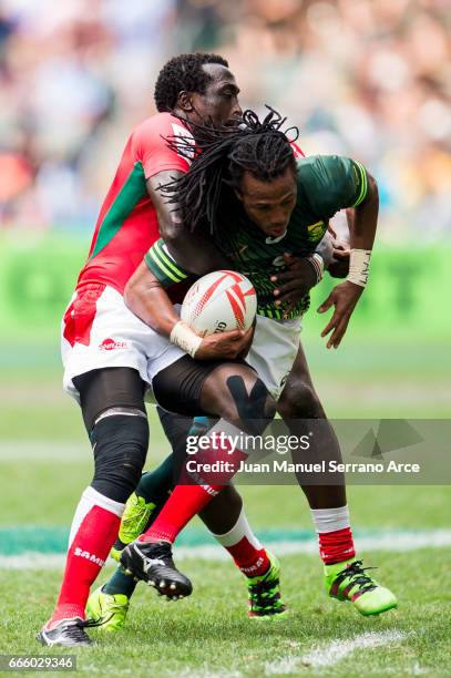 Cecil Afrika of South Africa is tackled during the 2017 Hong Kong Sevens match between South Africa and Kenya at Hong Kong Stadium on April 8, 2017...